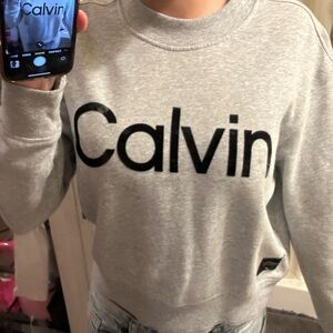 barely worn sweater! it has a few spots on it but there is no other damage.